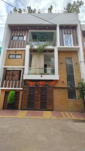 a large brick building with a large window at Nest & Fest in Indore