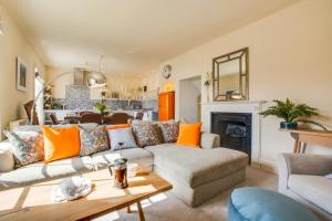 a living room with a couch and a fireplace at 4 Bed in Cromer oc-2117 in Cromer