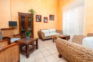 a living room with chairs and a couch and a table at L'Agora Hotel in Bocairent