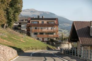 a house on the side of a winding road at haus urban in Barbiano