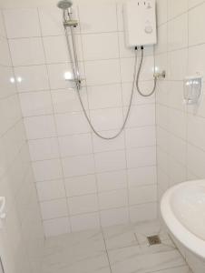 a bathroom with a shower and a sink at GuestHouse5 KARMA369 in Plovdiv