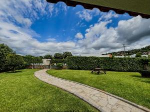 a park with a bench in the grass at Casa Antigo Alambique in Santa Cruz do Lima