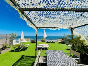 a patio with a view of the ocean at Residence Frontemare in Rimini