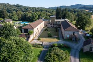 an aerial view of a large building with a driveway at VVF Château sur la Vienne Lac de Vassivière in Nedde +19 photos