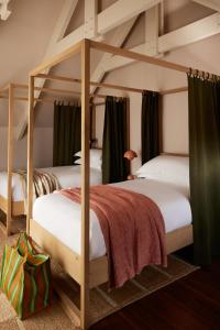 two bunk beds in a room at The Manor House at Colmant in Franschhoek