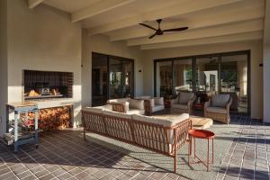 a living room with a couch and a fireplace at The Manor House at Colmant in Franschhoek