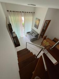 an overhead view of a living room with a couch at Casa summer flats 23 Imbassai in Imbassai +17 photos
