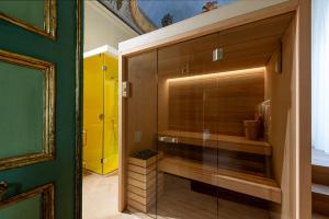 a bathroom with a shower with a glass wall at Palazzo Sbaraglini in Assisi