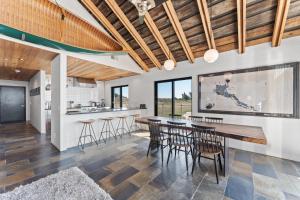 a kitchen and dining room with a table and chairs at Bodega Bay - Ocean View, Fireplace & BBQ in Bodega Bay +33 photos