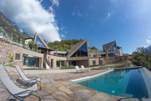 an exterior view of a house with a swimming pool at Agritur Lawanda in Vezzano