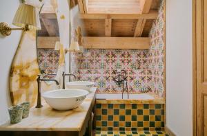 a bathroom with a sink and a bath tub at Hôtel Saint-Georges Relais & Châteaux in Megève +101 photos
