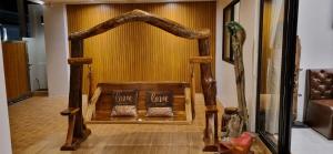 a wooden bed with two pillows in a room at Sila Thai Pool Villa3 in Ao Nang Beach