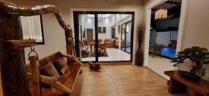 a hallway with a living room and a dining room at Sila Thai Pool Villa3 in Ao Nang Beach