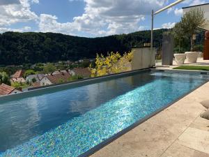 a swimming pool in the backyard of a house at Ferienchalets Riedenburg in Riedenburg