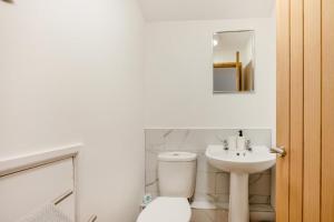 a bathroom with a toilet and a sink at 2 Bed in Neenton oc-s29533 in Neenton +26 photos
