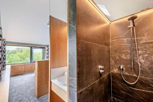 a bathroom with a shower and a sink at 4 Bed in Goodleigh oc-e29107 in Goodleigh +29 photos
