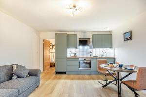 a living room with a couch and a table at 1 Bed in Ashcott oc-m33651 in Ashcott