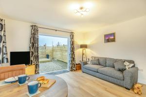 a living room with a couch and a table at 1 Bed in Ashcott oc-m33651 in Ashcott