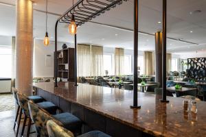 a bar in a lobby with chairs and tables at Best Western Plus Skogshöjd in Södertälje +66 photos