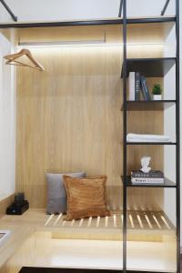 a room with a book shelf with two pillows at Toda House - 4Bedroom near Hoan Kiem Lake in Hanoi