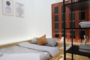 a room with a bunk bed and a shelf at Toda House - 4Bedroom near Hoan Kiem Lake in Hanoi