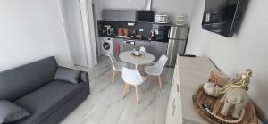 a living room with a couch and a table at DaRo-Appartments in Asprovalta
