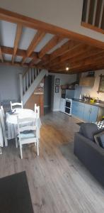 a living room with a table and a couch at Island View Lodge in Doolin