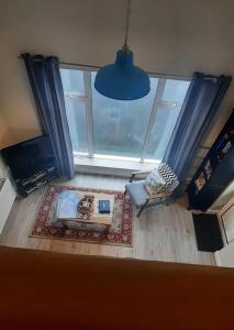 an overhead view of a living room with a large window at Island View Lodge in Doolin