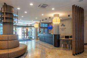 an office with a reception desk and a lobby at Flair Park Hotel Ilshofen in Ilshofen +145 photos