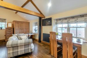 a kitchen and living room with a table and a couch at 1 Bed in Brampton oc-g34638 in Brampton
