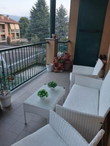 a balcony with chairs and a table with plants on it at "Da Zia House Comfort e Relax vicino a Torino" in Brandizzo