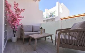 a living room with a couch and a table at Sea Casa Rosa in Mijas Costa
