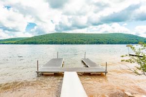a dock in the middle of a body of water at Captains Quarters by Railey Vacations in Oakland