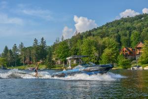 a man is riding a boat on the water at Captains Quarters by Railey Vacations in Oakland