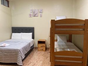 a small bedroom with a bunk bed and a ladder at Sol de sauce - Casa Vacation Stay in Sauce +15 photos