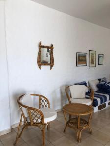 a living room with a couch and a table and chairs at Villa Thalassa in Oualidia +37 photos
