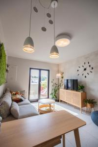 a living room with a couch and a table at Apartmani Vale in Hvar