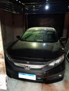 a black car parked in a garage at Riviera engenharia in Campo Grande