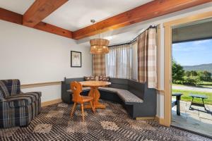 a living room with a table and a couch at von Trapp Family Lodge & Resort in Stowe