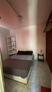 a bedroom with a bed in a room at Maximina Home in Comodoro Rivadavia