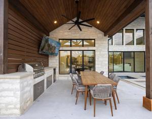 a kitchen with a wooden table and chairs at LBJ Retreat in Kingsland