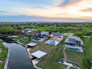 an aerial view of a large house with a river at LBJ Retreat in Kingsland