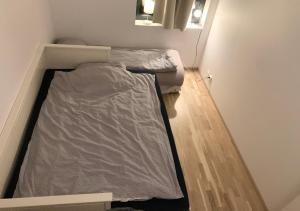 a small room with two beds in the corner at Private bedroom in Moss