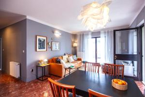 a living room with a table and a couch at Apartmani Vale 2 in Hvar