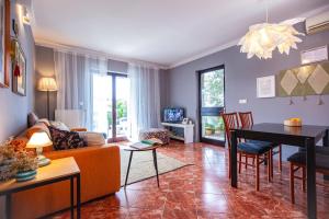 a living room with a couch and a table at Apartmani Vale 2 in Hvar