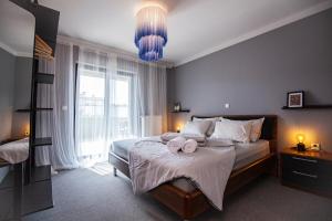 a bedroom with a bed with two towels on it at Apartmani Vale 2 in Hvar