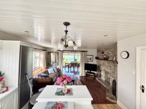 a living room with a couch and a table at Anchor Haven in Goleen