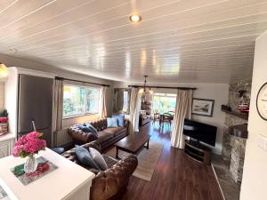a living room with a couch and a table at Anchor Haven in Goleen