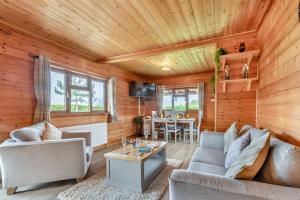 a living room with wooden walls and a wooden ceiling at 2 Bed in Somerton oc-w29203 in Somerton