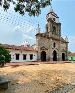 an old building with a tower on top of it at Casa vacacional SAMUEL in Honda